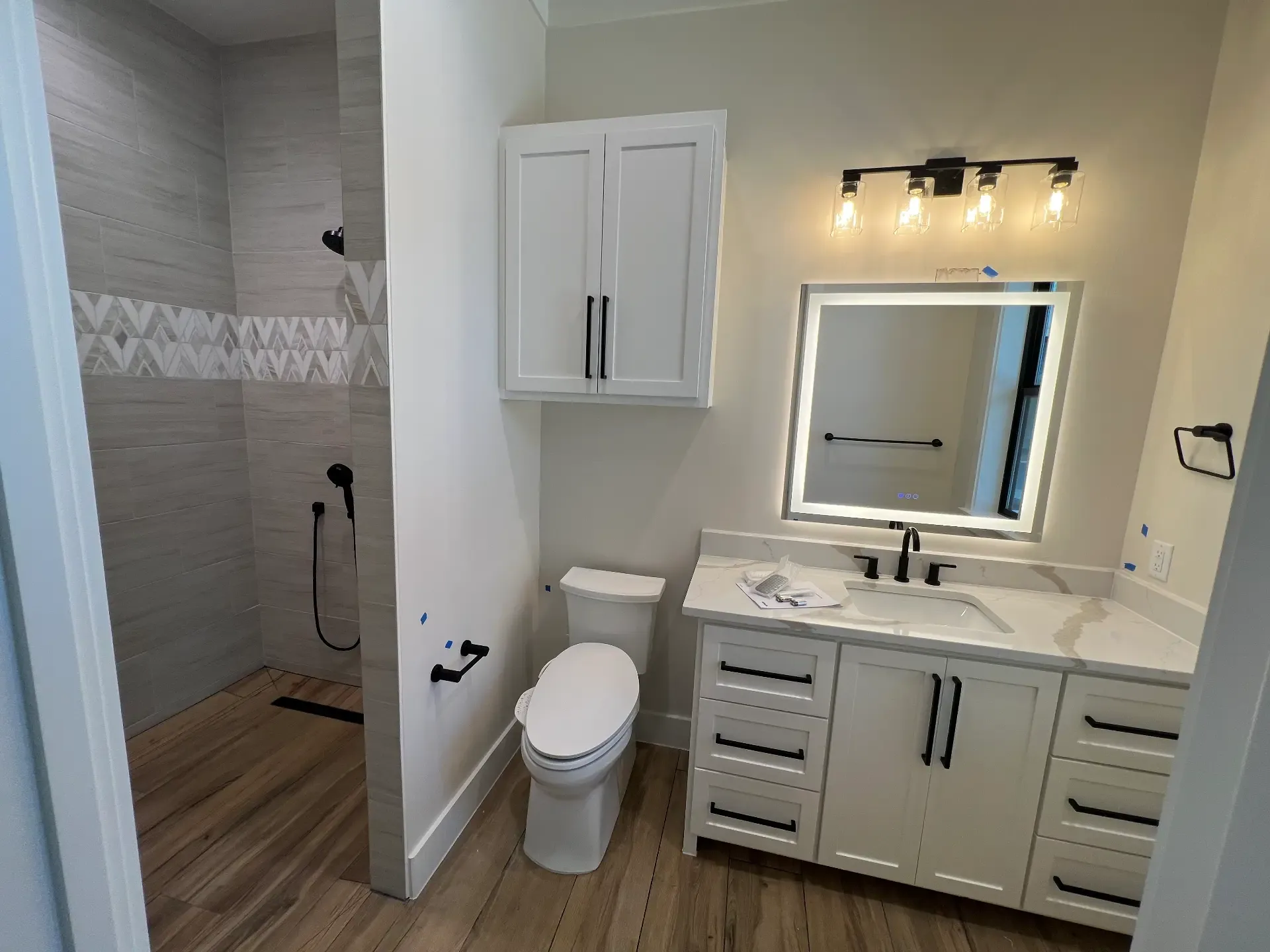 Primary bathroom vanity with an LED mirror in a Venado Construction new home build